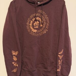 Mountain Hardwear Purple Hoodie with Butterfly Motifs